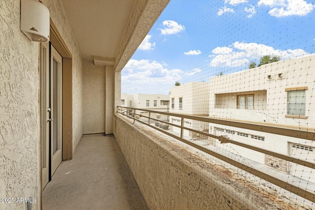 balcony featuring an AC wall unit