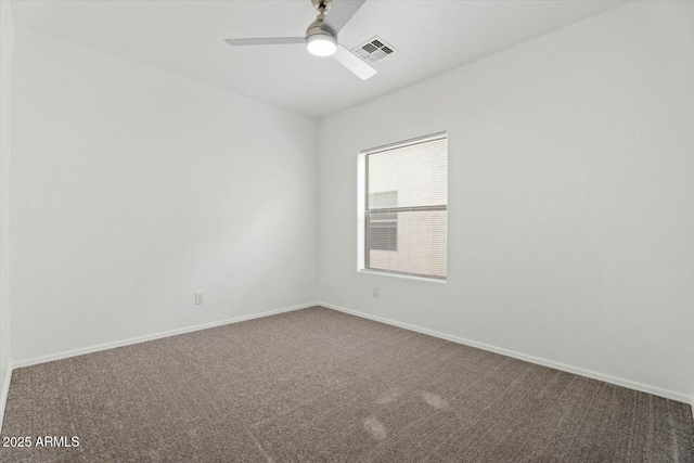 empty room with visible vents, baseboards, ceiling fan, and carpet floors