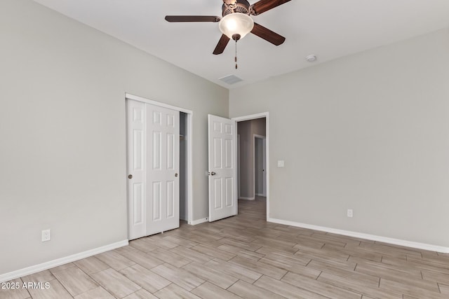 unfurnished bedroom with a closet and ceiling fan