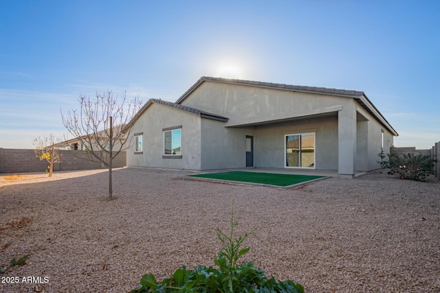 back of property featuring a patio area