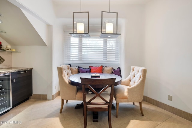 tiled dining space featuring wine cooler