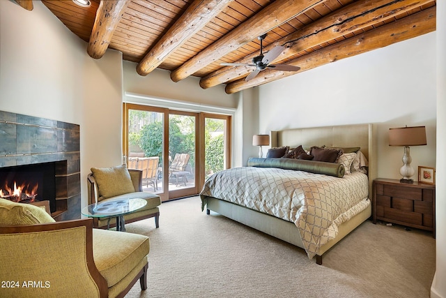 carpeted bedroom with beamed ceiling, ceiling fan, wood ceiling, and access to outside