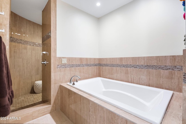 bathroom with tiled tub