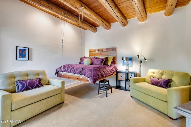 bedroom featuring carpet, beam ceiling, and wooden ceiling