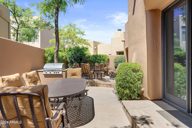 view of patio / terrace with a grill and an outdoor hangout area