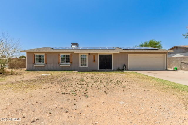 1676 W Sequoia Dr, Phoenix, AZ 85027 - ranch-style house featuring a garage, solar panels, and concrete driveway