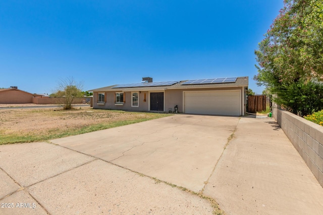 1676 W Sequoia Dr, Phoenix, AZ 85027 - view of front facade with a garage, driveway, and roof mounted solar panels