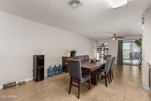 dining room with ceiling fan and light tile patterned flooring