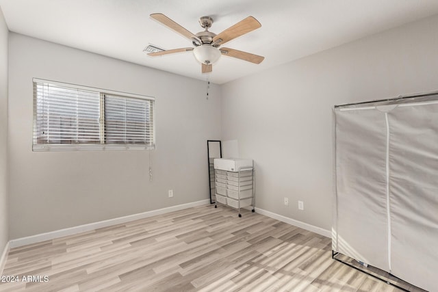 unfurnished bedroom featuring ceiling fan and light wood-type flooring