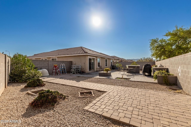 rear view of property with a patio