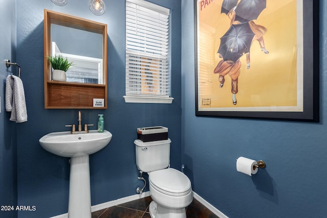 bathroom with tile patterned flooring and toilet