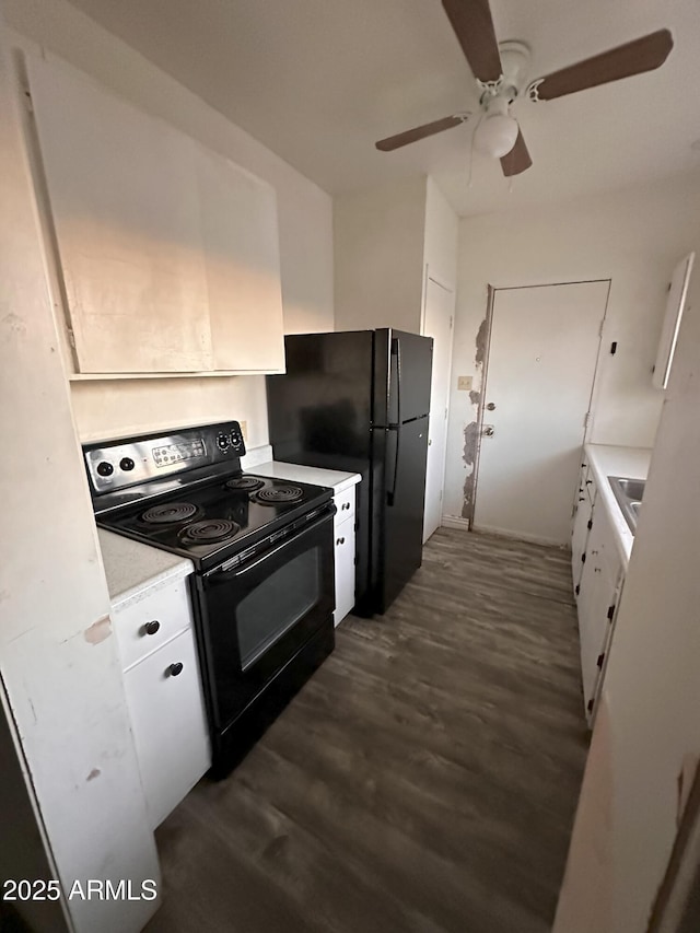 kitchen with white cabinetry, black appliances, dark hardwood / wood-style floors, and ceiling fan