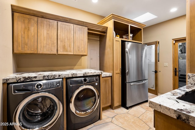 laundry room featuring recessed lighting, light tile patterned flooring, and separate washer and dryer