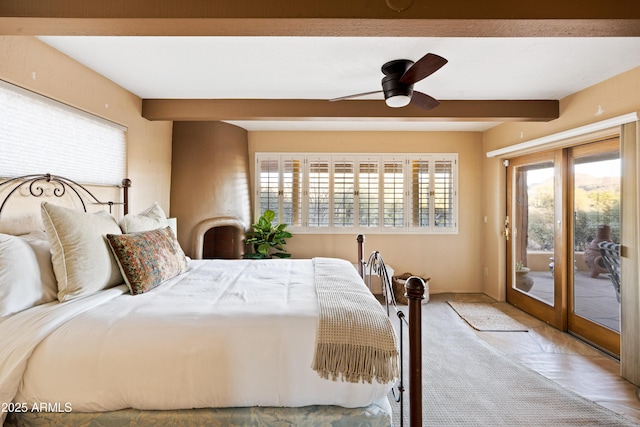 bedroom with access to outside, beamed ceiling, and ceiling fan