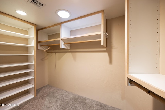 walk in closet with carpet flooring and visible vents