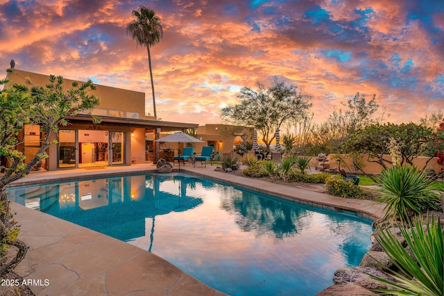 pool with a patio area