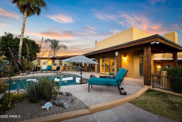 view of pool featuring a patio area, fence, and a fenced in pool