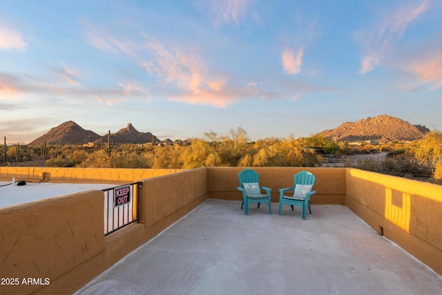 view of patio / terrace featuring a mountain view