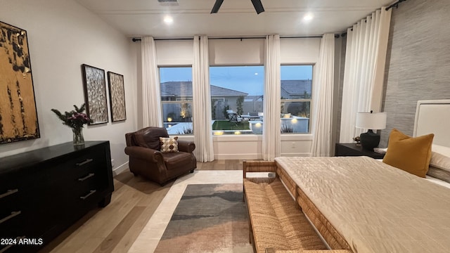 bedroom with light wood-type flooring and ceiling fan