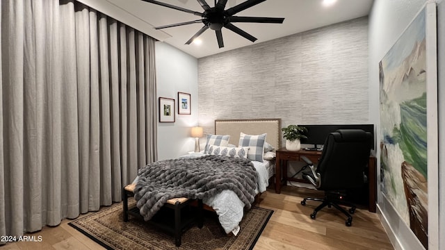 bedroom featuring ceiling fan and light hardwood / wood-style floors