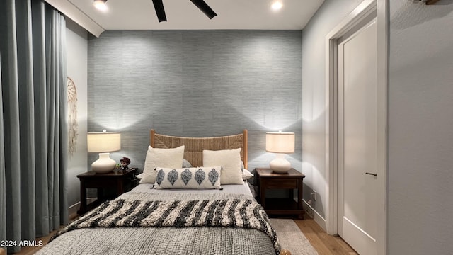 bedroom featuring ceiling fan and light hardwood / wood-style floors