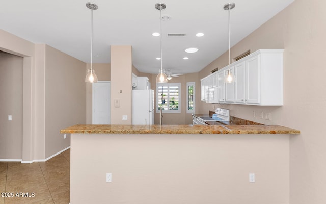 kitchen with white appliances, kitchen peninsula, hanging light fixtures, ceiling fan, and white cabinetry