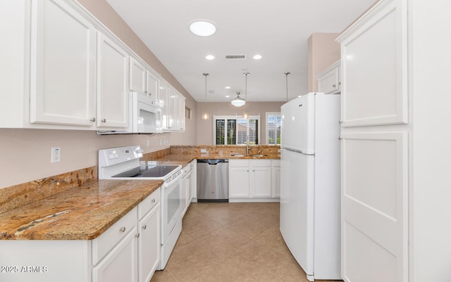 kitchen with kitchen peninsula, light stone counters, white appliances, decorative light fixtures, and white cabinets