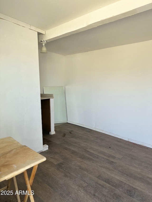 unfurnished room with dark wood-style floors