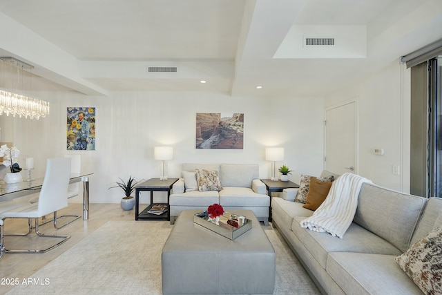 living area with recessed lighting, visible vents, and an inviting chandelier