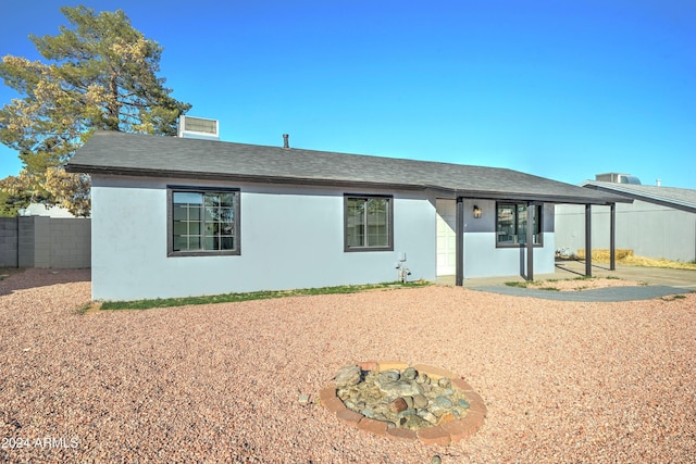 view of front of property with an outdoor fire pit