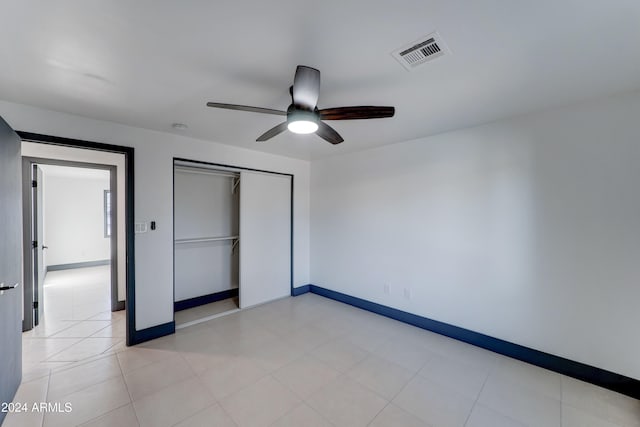 unfurnished bedroom with a closet and ceiling fan