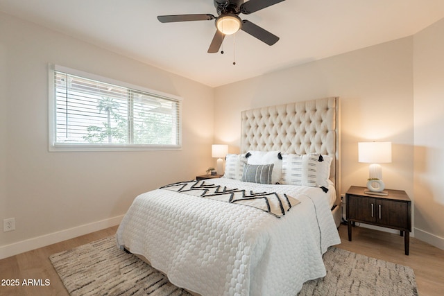 1301 N 44th St, Phoenix, AZ 85008 - bedroom featuring baseboards, wood finished floors, and a ceiling fan
