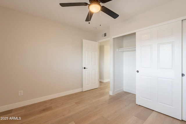 1301 N 44th St, Phoenix, AZ 85008 - unfurnished bedroom with light wood-type flooring, baseboards, and a closet