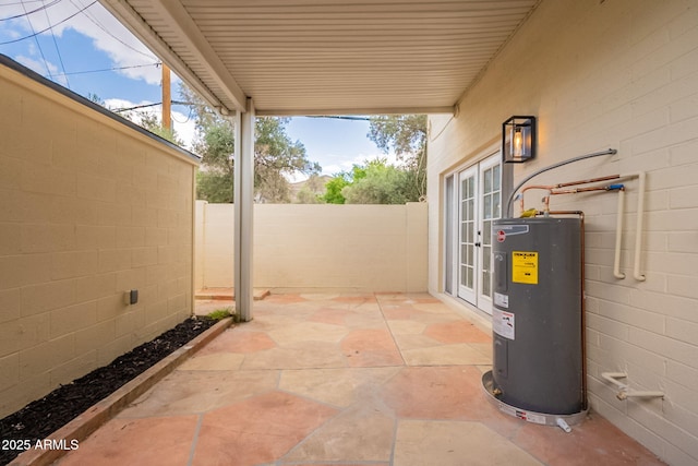 1301 N 44th St, Phoenix, AZ 85008 - fenced backyard with electric water heater and a patio