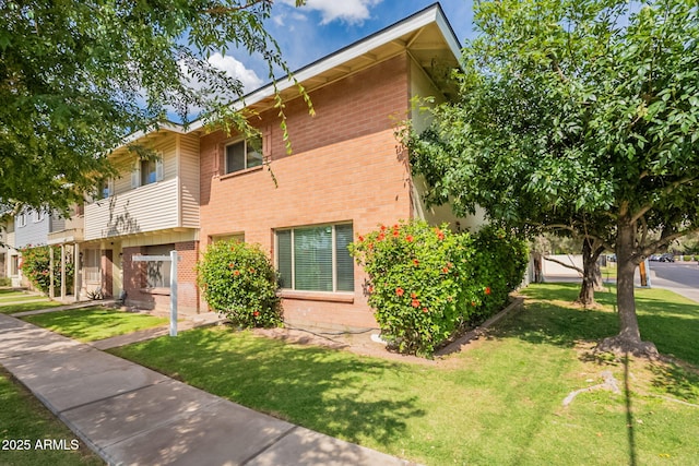 1301 N 44th St, Phoenix, AZ 85008 - view of front of property featuring brick siding and a front yard