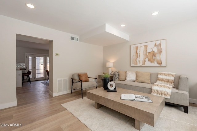 1301 N 44th St, Phoenix, AZ 85008 - living area with baseboards, light wood-style floors, recessed lighting, and french doors