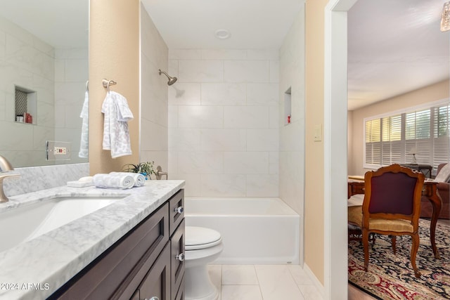 full bathroom featuring vanity, toilet, and tiled shower / bath combo