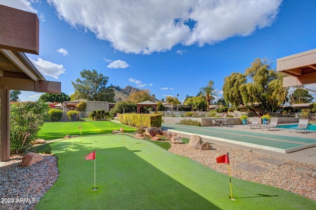 view of property's community with a gazebo and a pool