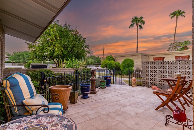 view of patio terrace at dusk