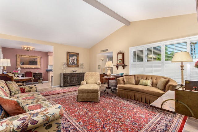 living room with lofted ceiling with beams