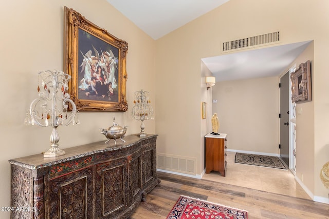 hall with hardwood / wood-style floors