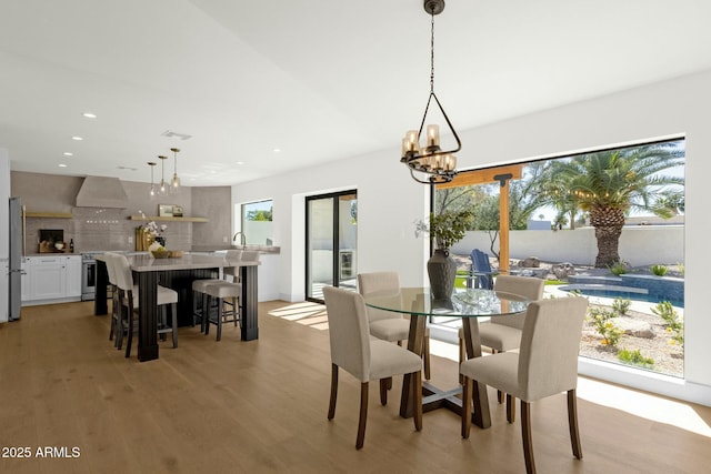 10013 N 106th Pl, Scottsdale, AZ 85258 - dining room featuring a chandelier, visible vents, recessed lighting, and light wood-type flooring