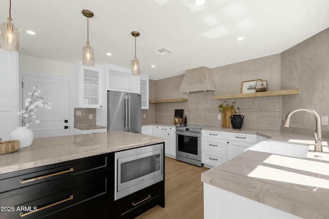 10013 N 106th Pl, Scottsdale, AZ 85258 - kitchen with premium range hood, open shelves, a sink, appliances with stainless steel finishes, and tasteful backsplash