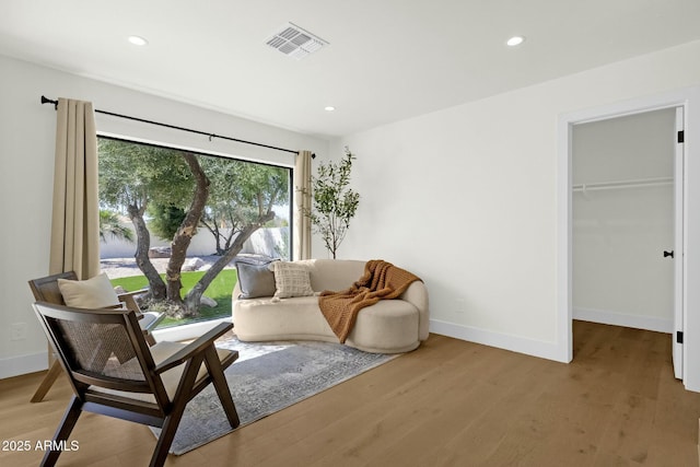 10013 N 106th Pl, Scottsdale, AZ 85258 - living area featuring recessed lighting, wood finished floors, visible vents, and baseboards