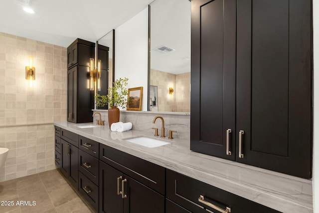 10013 N 106th Pl, Scottsdale, AZ 85258 - full bath with a sink, visible vents, tile walls, and tile patterned floors