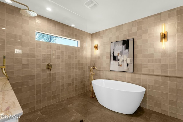 10013 N 106th Pl, Scottsdale, AZ 85258 - full bath with tile patterned flooring, visible vents, walk in shower, a freestanding tub, and tile walls