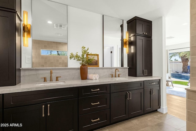 10013 N 106th Pl, Scottsdale, AZ 85258 - full bath with decorative backsplash, visible vents, tile patterned flooring, and a sink