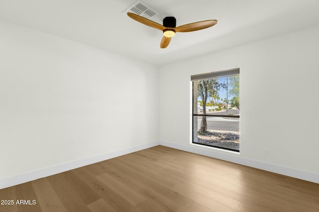 10013 N 106th Pl, Scottsdale, AZ 85258 - spare room with visible vents, a ceiling fan, baseboards, and wood finished floors