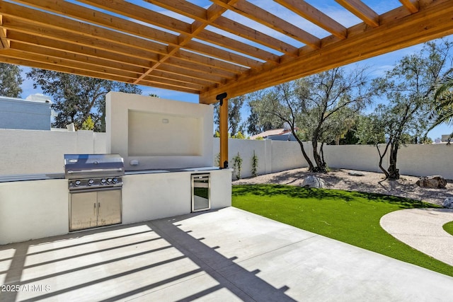 10013 N 106th Pl, Scottsdale, AZ 85258 - view of patio / terrace featuring an outdoor kitchen, a fenced backyard, and a grill