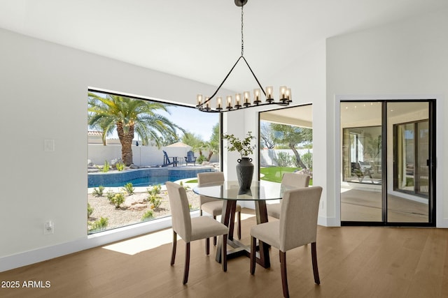 10013 N 106th Pl, Scottsdale, AZ 85258 - dining room featuring a notable chandelier and wood finished floors